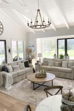 Unleash your creativity with these 7 inspiring ceiling ideas that will add character and charm to your farmhouse living room. From shiplap accents to decorative molding, each idea is sure to infuse warmth and personality into your space. Embrace the opportunity to reimagine your living room's ambiance today! Chandelier Vaulted Ceiling, Farmhouse Chandelier Living Room, Farmhouse Ceiling Lighting, Shiplap Ceilings, Chandelier Living Room