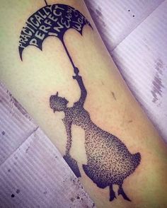 a person with an umbrella tattoo on their arm