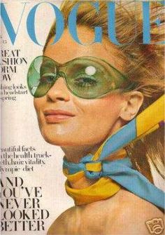 a magazine cover with a woman wearing goggles and a scarf on the front page