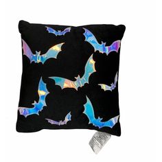 a black pillow with bat designs on it