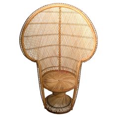 a wicker chair with an umbrella shaped seat