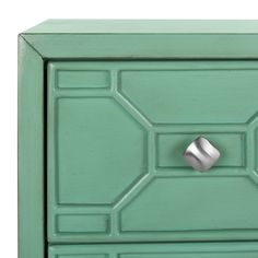 a close up of a green cabinet with a metal knob on the front and bottom