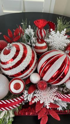 red and white christmas ornaments on a table