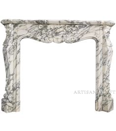 a white marble fireplace surround with carvings on the top and bottom, in an ornate manner