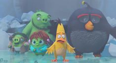 the angry birds are standing next to each other in front of icebergs and snow