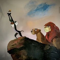 the lion and the mouse are standing on top of a rock with their arms in the air