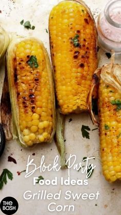 grilled corn on the cob with butter and seasoning next to it,