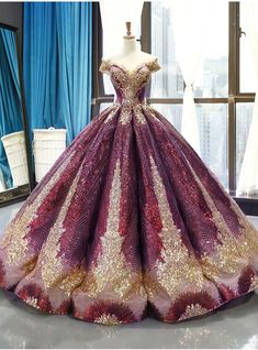 This dress is the definition of grandeur and majesty. The splendid mixture of shades of purple and golden enhances the overall look of the haute couture. The sexy bodice is bedecked with gold sequins and the gown is also patterned with exquisitely designed gold sequins. Purple Ball Gown, डिजाइनर कपड़े, Ball Gowns Evening, Fantasy Gowns, Fairytale Dress, Ball Gowns Prom, Quince Dresses, Ball Gown Dresses, Gorgeous Gowns