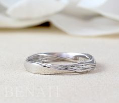 "Exclusive to Benati. A new meaningful, contemporary mobius inspired wedding band. A rectangle profile - one side of the ring are made to a high polish and one made with wood finish to enhance to mobius effect. This ring has 4 twists, so it is very interesting from every angle. No beginning or end. Made from solid 14k/18k gold or platinum. Width of ring is approx.: 3 mm (0.11\"). This mobius ring also makes for the perfect dream wedding ring for those that enjoy a more simplistic style. It also Modern Twist Stackable White Gold Wedding Rings, Texture Wedding, Minimalist Gold Ring, Textured Wedding Band, Mobius Ring, Elegant Wedding Rings, Dream Wedding Ring, Wedding Band Designs, Infinity Ring