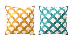 two decorative pillows in different colors and sizes, one is gold and the other is teal