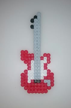 a cell phone made out of legos on a white surface with red, white and blue beads