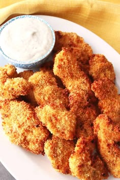 fried chicken nuggets with ranch dip on the side