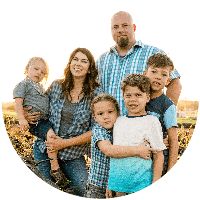 a family is posing for a photo in the middle of a circle with their arms around each other