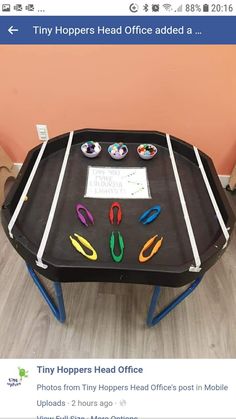 a table with scissors and magnets on it