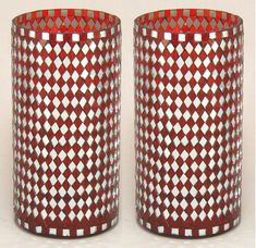 two red and white vases sitting next to each other