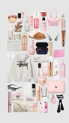 the contents of a woman's purse are arranged in pink and white, including an iphone