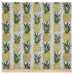 a white and yellow wallpaper with pineapples on it