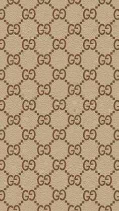 a beige and brown wallpaper with the letter g on it