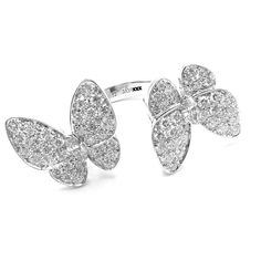 Van Cleef & Arpels 18k White Gold Diamond Two Butterfly Between Finger Ring  Metal: 18k White Gold  Size: European 52, US 6  Weight: 9.2 grams  Width; 20mm  Stones: 70 round brilliant cut diamond VVS1 clarity, E color total weight 1.67ct  Hallmarks: Cartier 750 52 JA19XXX (Serial Omitted) T3352ooled  Dimensions reference the ring size and are not specific to the ring itself. Between Finger Ring, Ring Metal, Van Cleef Arpels, Van Cleef, Finger Ring, Ring Finger, Round Brilliant Cut Diamond, Round Brilliant Cut, Brilliant Cut Diamond