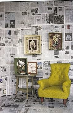 a yellow chair sitting in front of a wall with pictures on it's sides