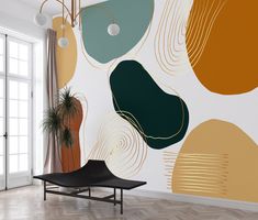 a living room with an abstract wallpaper design