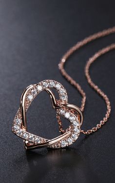 This simple yet classic double interlock heart pendant is designed with a hollow rose gold heart interlocked with a crystal encrusted rose gold heart to make this gorgeous necklace pendant which is set on a simple chain for added effect. Specifications:    metal alloy with hand polish  nickel-free, cadmium free, and lead-free  perfect for all occasions like engagement, the office, and parties or great for a night out  a stylish gift for loved ones (sister, friends, or mum)  comes in an necklace Necklace For Friends, Cute Necklace Gold, Stylish Jewelry Gold, Gold Necklace Designs For Women, Simple Pendant Design, Simple Jewelry Necklace, Rose Gold Necklace Set, Irina Jelavic, Cute Pendant Necklace