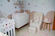 a baby's room is decorated in pink and white