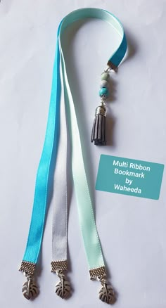 a blue lanyard with two tassels attached to it