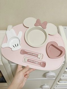 a child's play table with mickey mouse plates and utensils on it