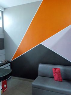 an orange and grey wall in a living room