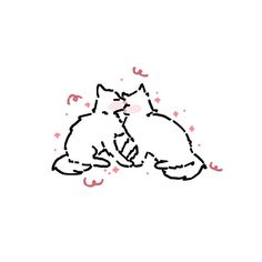 two cats sitting next to each other on top of a white surface with pink confetti around them