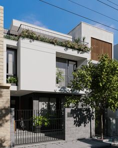 an apartment building with plants growing on the balconies