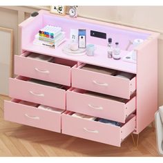 a pink dresser with many drawers in it