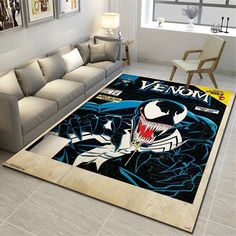 a living room with a large rug on the floor that has an image of batman