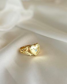 This Heart Locket Ring is crafted from gold plated silver for a luxurious feel and timeless look. Its elegant design is perfect for the special occasions that call for you to make a powerful, romantic statement. Wear it to express love, adoration, or devotion. Luxury Jewelry For Valentine's Day Proposal, Gold-plated Promise Rings, Silver Gold Plated Wedding Rings, Silver Gold-plated Wedding Rings, Wedding Gold Plated Silver Rings, Wedding Silver Gold-plated Ring, Luxury Valentine's Day Proposal Jewelry, Classic Gold Crystal Ring As Gift, Dainty Gold Flower Ring For Anniversary