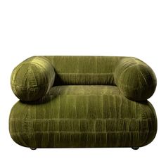 a green couch sitting on top of a white floor