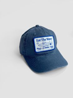 EAT THE WAVE - Yeah Sure Crafted with a classic silhouette and a faded blue hue. Hit the beach in ultimate comfort with our pre-washed cotton surf-style hat. Engineered to provide a relaxed, broken-in feel from the get-go. Vintage Snapback Baseball Cap For Beach, Vintage Snapback Cap For The Beach, Retro 5-panel Trucker Hat For Beach, Cotton 5-panel Trucker Hat For Beach, Vintage 5-panel Trucker Hat, Style Surf, Surf Hats, Vintage Surf, Surf Style