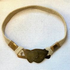 a necklace with two pieces of stone on it, and some beads around the clasp