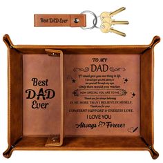 a leather case with two key chains attached to it and the words best dad ever