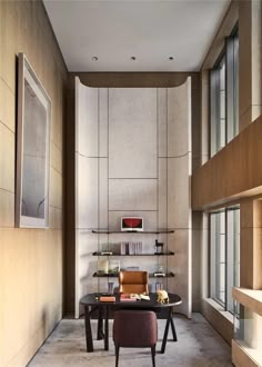 a living room filled with furniture next to a wall covered in bookshelves and windows