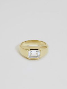 Signet rings were historically used as identity markers, wearable tools for sealing official documents. Ours incorporates an elegant detail — set flush with an emerald cut diamond in the size of your choice. The Sienna Emerald Cut band measures approximately 7mm wide in the front, tapering to 3.5mm in the back. Our cla Emerald Cut Band, Classy Engagement Ring, J Hannah, Diamond Signet Ring, Signet Rings, Diamond Jewelry Designs, Emerald Cut Diamond