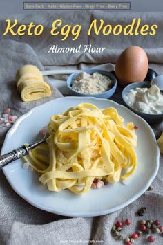 the cover of keto egg noodles is shown on a plate with other ingredients around it