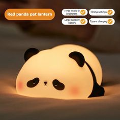 a panda lamp sitting on top of a bed