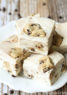 white chocolate cookie dough fudge is cut into squares and stacked on top of each other