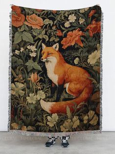 a tapestry with a fox and flowers on it