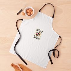 an apron with the words happy baking on it next to eggs and utensils