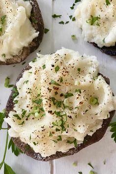 an open faced sandwich with mashed potatoes and chives on top, garnished with parsley