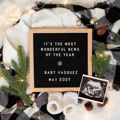 a baby's first christmas card and booties are on display