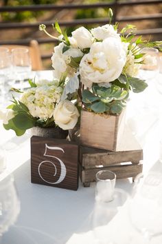 a table with flowers and candles on it