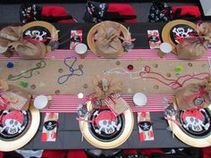 the table is set with pirate themed plates and napkins